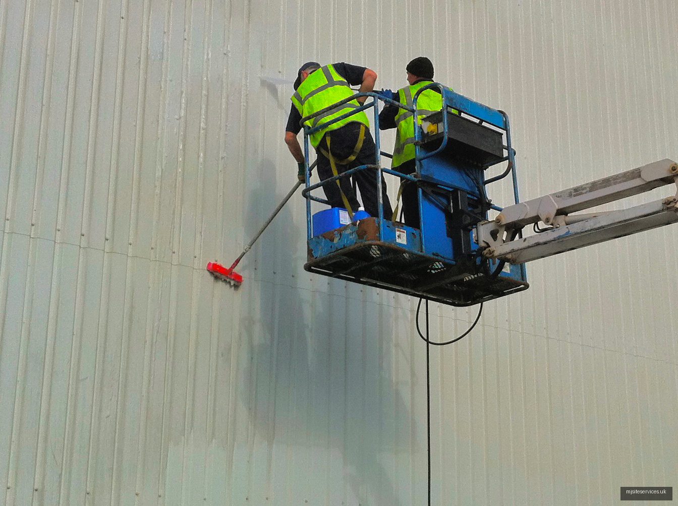 Industrial pressure washing in progress